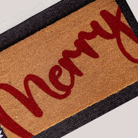 Merry Berry natural coir doormat featuring bold red Merry script on tan coconut fiber background