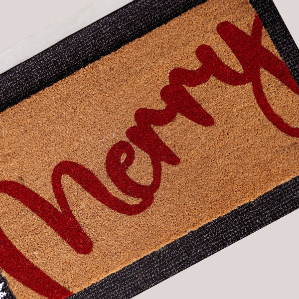 Merry Berry natural coir doormat featuring bold red Merry script on tan coconut fiber background